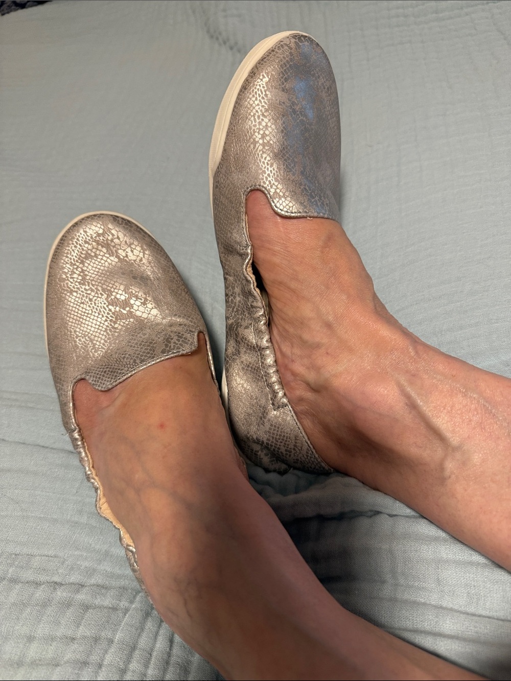 Women's Metallic Fitkicks Slip-On Loafers in Shimmering Silver.